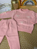 Conjunto tejido rosa lazos