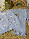 Conjunto tejido celeste lazos