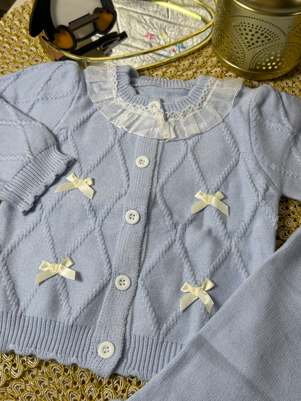 Conjunto tejido celeste lazos