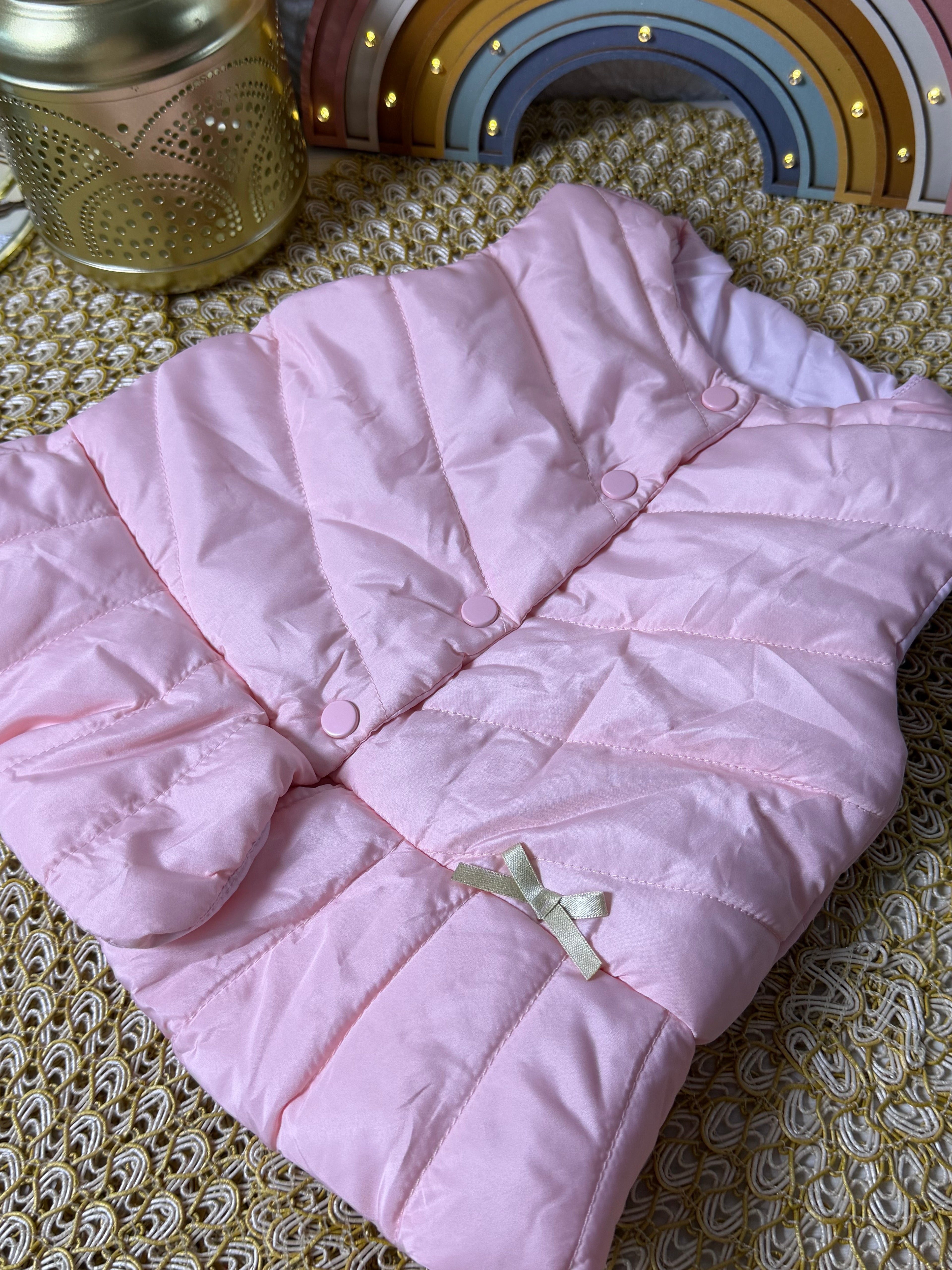 Chaqueta rosada lazo