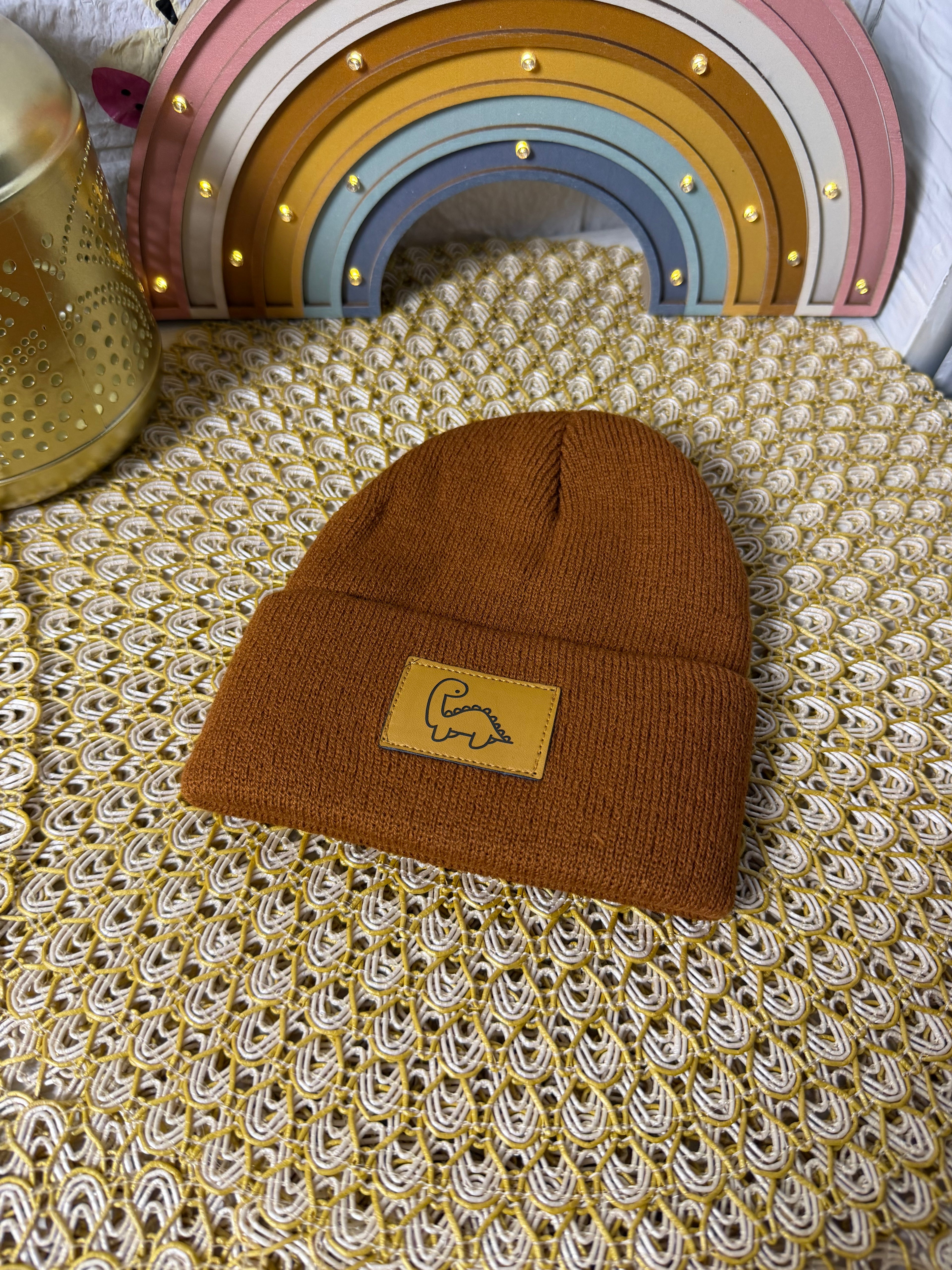 Gorro de punto dinosaurio etiqueta