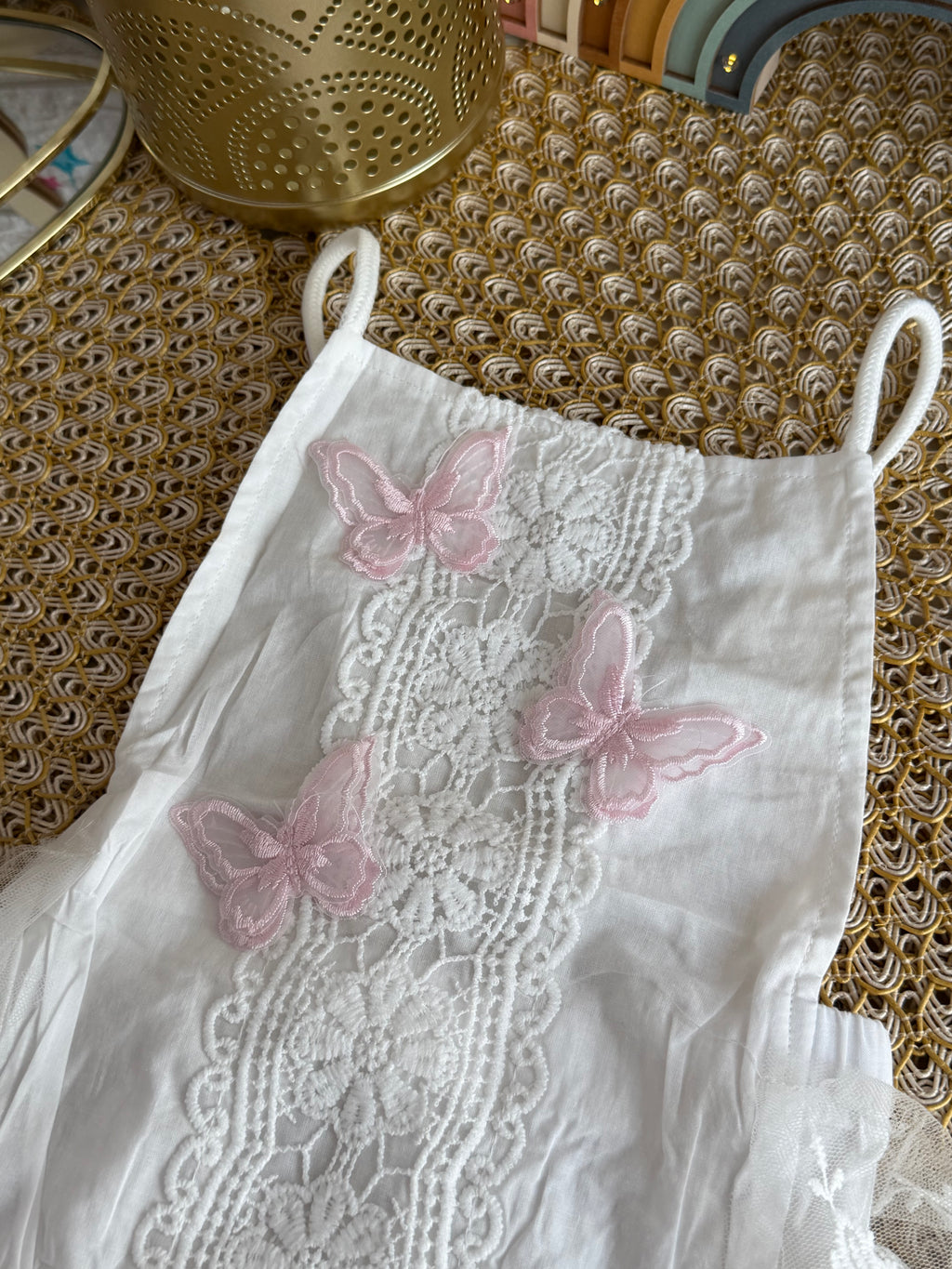 Pelele con mariposas rosadas
