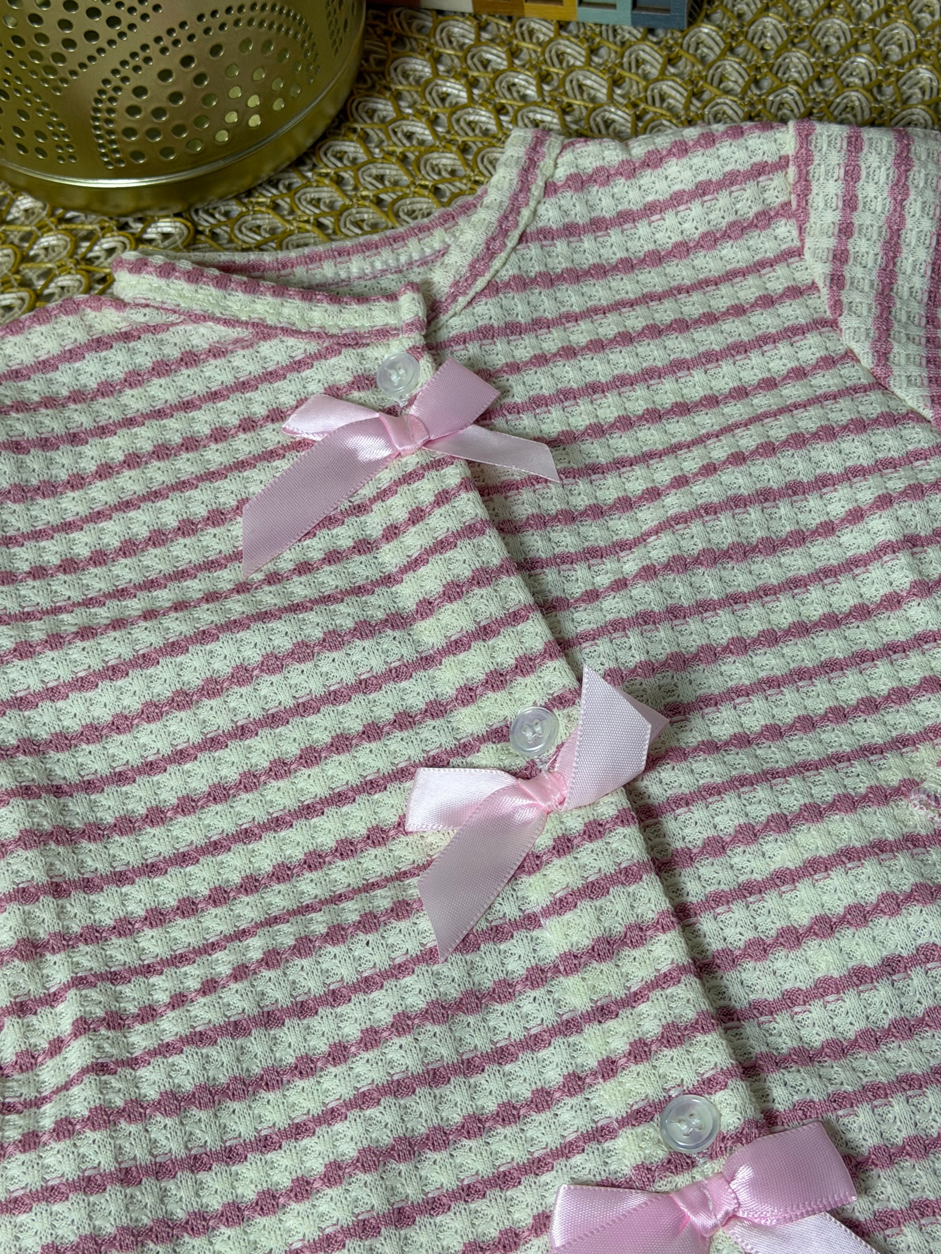 Cardigan de punto a rayas rosa